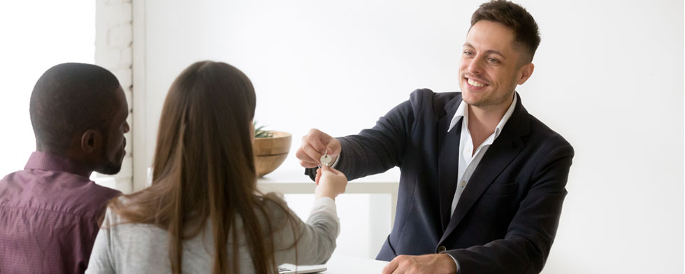 couple purchasing a house and receiving the key