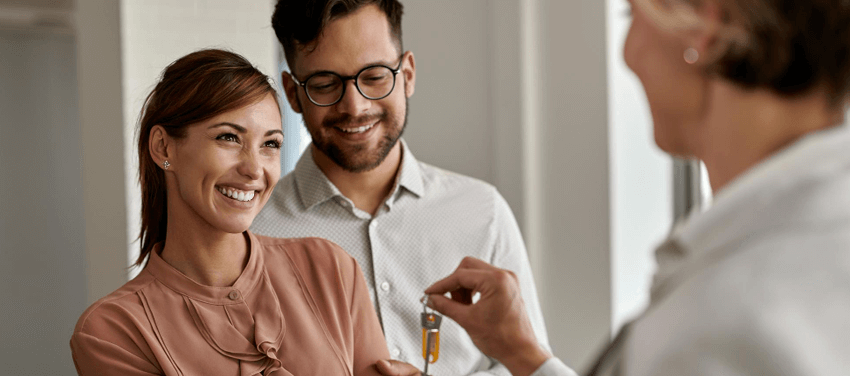 happy couple buying new house